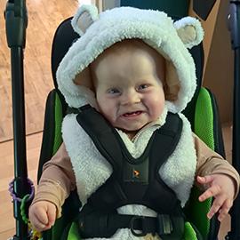 Alec in his Snappi pushchair