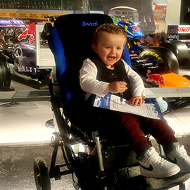 Child in their Snazzi pushchair