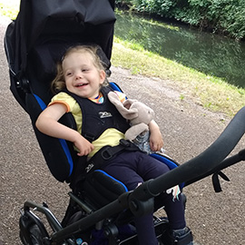 Child in their Snappi Swirl pushchair