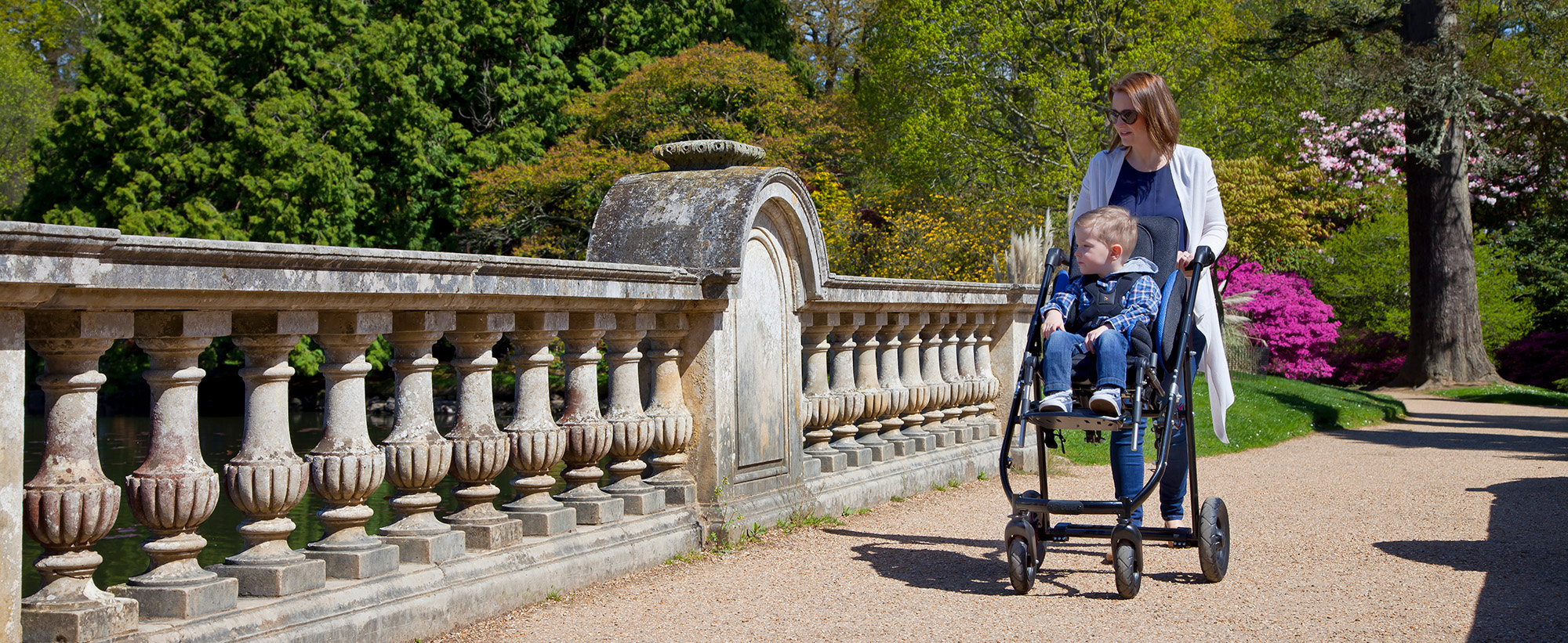 Family out and about using a Tendercare pushchair